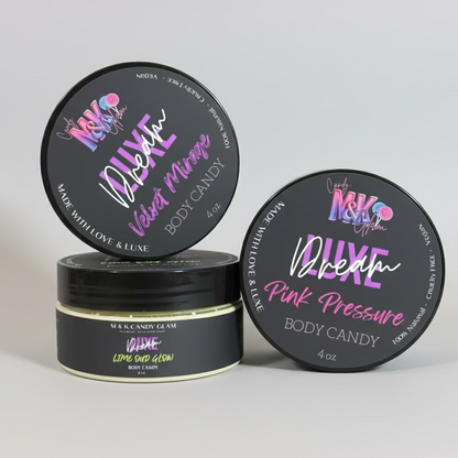 Three containers of body candy with colorful labels on a pink geometric background