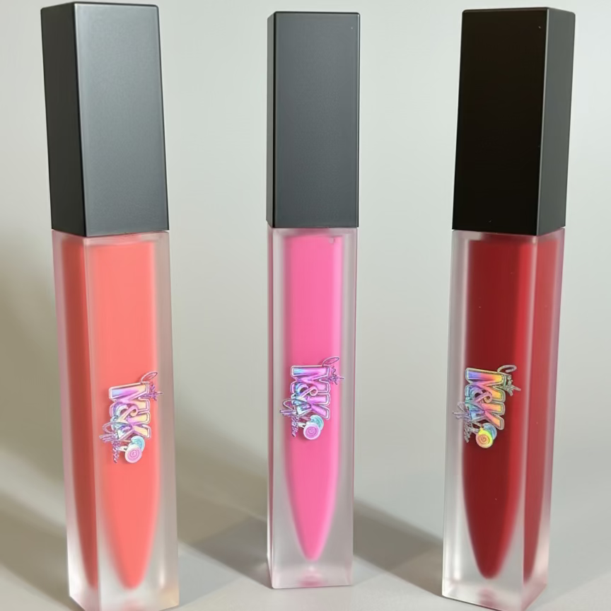 Three lip glosses with black caps 