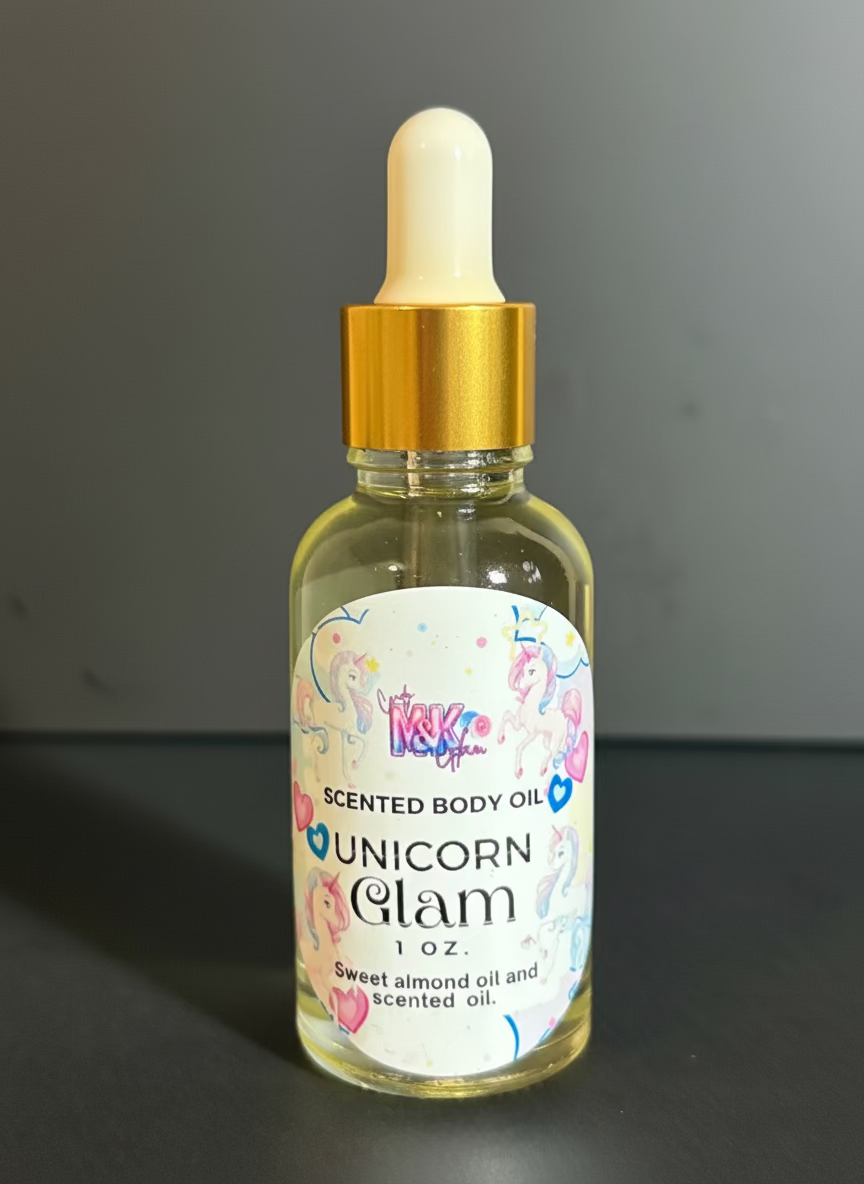 Bottle of 'Unicorn Glam' scented body oil with a gold dropper on a dark background